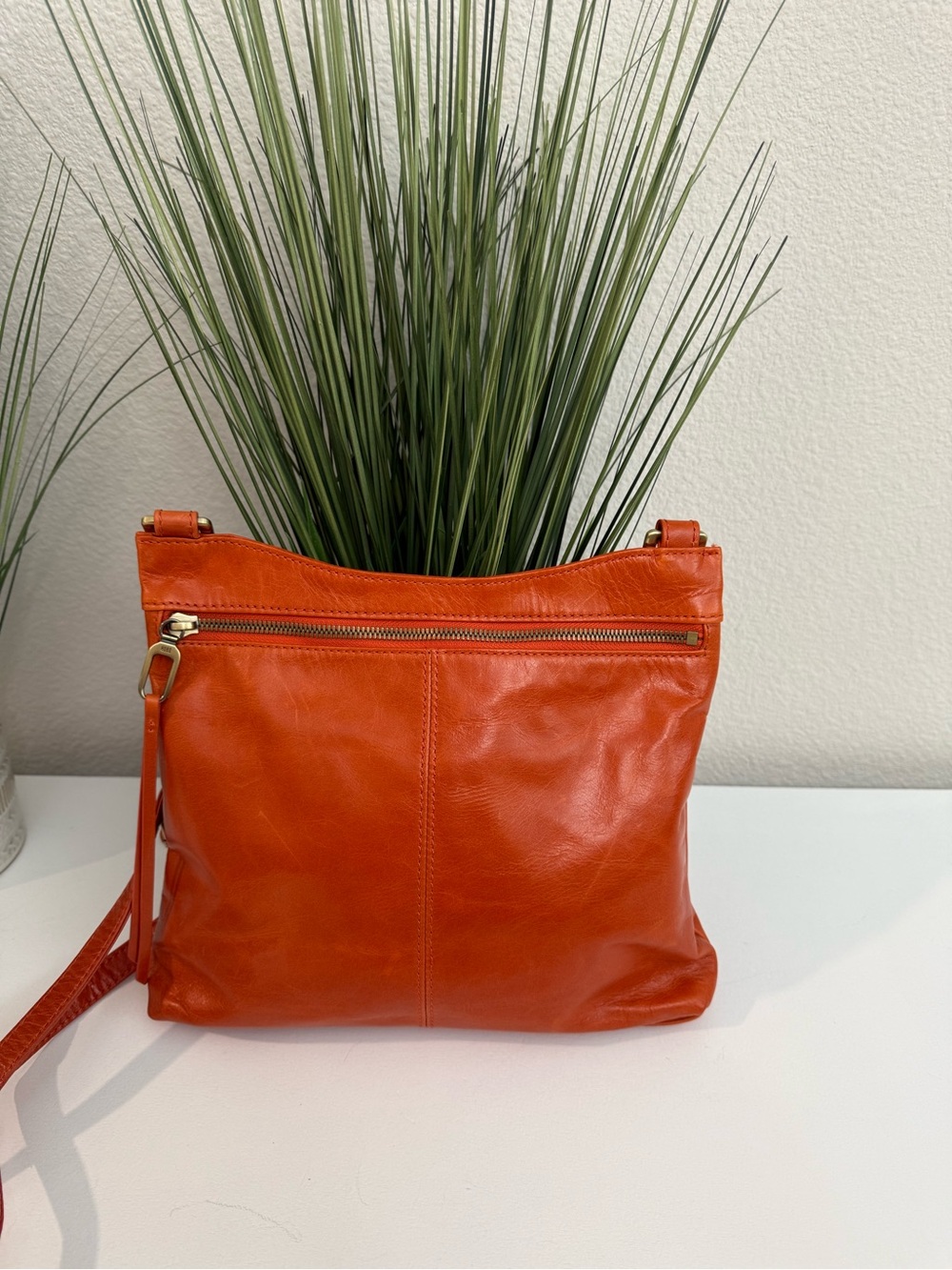 HOBO CAMBEL Leather Crossbody Bag in Orange
